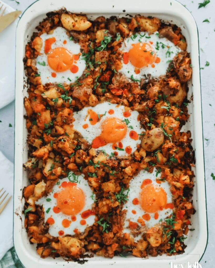 Sprout and harissa potato hash with sunny-side eggs, hearty flexitarian recipes cooked for winter.