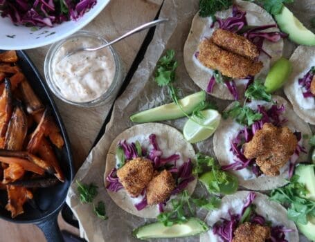 crispy cod tacos overhead shot with sweet potatoes chilli cream and slaw