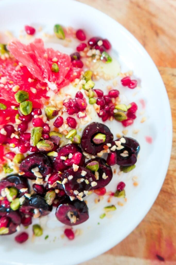 a perfectly assembled breakfast bowl overhead shot showcasing all the seasonal ingredients